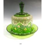 A Victorian green glass cheese dish and cover, with gilt and white decoration