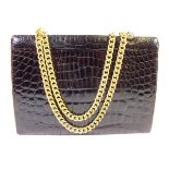 A vintage crocodile skin handbag