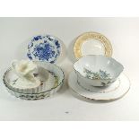 Two Royal Worcester flan dishes and a bowl plus a gilt and white cake stand and dolphin and shell