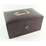 A Victorian red leather jewellery box with key