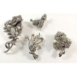 A Sphinx marcasite brooch, poodle brooch and two others
