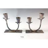 A pair of Oneida silver plated candlesticks
