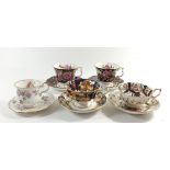 A group of decorative cabinet cups and saucers including Royal Doulton 'Heirloom' cup and saucer etc