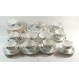 A Coclough tea service decorated leaves comprising: five cups and saucers, twelve tea plates, two