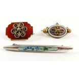 A Norwegian silver and enamel brooch and two other enamel brooches