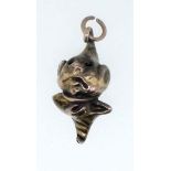 A late 19th/early 20th century yellow metal charm of a jester's head