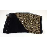 An early 20th century black chiffon evening wrap with gold sequin decoration