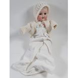 An Armand Marseille doll No 990, eyes detached