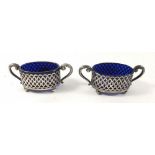 A pair of oval silver salts with blue glass liners, Birmingham 1903, 8.5cm wide