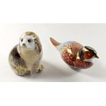 A group of Royal Crown Derby Imari paperweights in the from of a King Charles Spaniel and