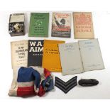 A selection of WW2 militaria to include booklets, propaganda, Union flag, a box of military buttons,