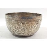 An Indian white metal bowl embossed peacocks and trees, 14cm diameter