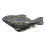 An oriental painted spelter small fish, 9cm across