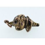 A late 19th/early 20th century yellow metal charm of a jester