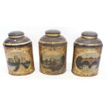 A set of three large Victorian tin Tole Ware shop display tea cannisters painted numbered landscap