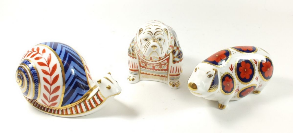 A group of three Royal Crown Derby Imari paperweights in the form of a pig, snail and bulldog (no