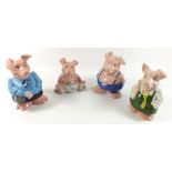 A set of four Nat West Wade piggy banks