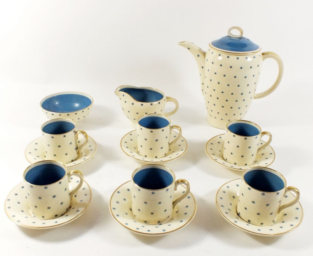 A Susie Cooper coffee set in the 'Blue Stars Pattern' comprising coffee pot, milk jug, sugar, six