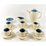 A Susie Cooper coffee set in the 'Blue Stars Pattern' comprising coffee pot, milk jug, sugar, six