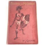 A first edition 'Fighting the Matabele' by J Chalmers 1898 and a postcard of Sultan Ikoma and his