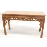 A Chinese lightwood alter table with carved frieze and brackets, 135cm wide x 50cm deep x 80cm tall