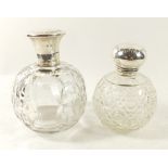 A cut glass large scent bottle with silver lid, Sheffield 1922 and another with silver lid but no