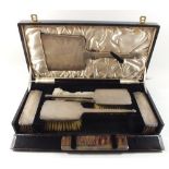 A silver five piece Art Deco brush set