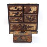 A Japanese cork cabinet of small drawers, 30cm high and an Art Deco box