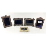 Four miniature silver photograph frames with embossed decoration, Sheffield various date marks,