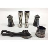 A Victorian bully beef bulls head tin opener, a pair of spirit boot measures and a silver plated