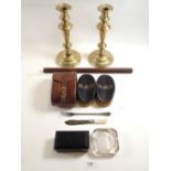 A pair of Georgian brass candlesticks, 25cm a cylindrical rosewood rule, pair of ebony brushes