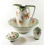 A Burleighware toiletry set comprising jug and bowl, toothbrush mug and soap dish - printed flowers