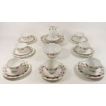 A M & Z Austria part tea service comprising: seven tea cups, nine saucers, nine side plates, one