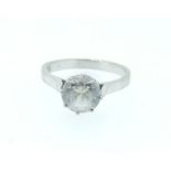 An 18 carat white gold ring set paste stones, 3.4g, size M