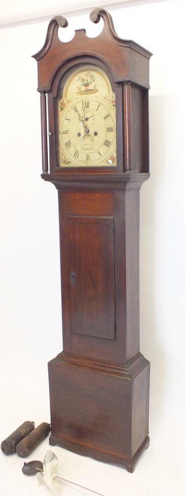 An 18th century oak longcase clock with painted dial by J Moseley, Swansea, eight day striking