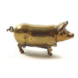 A small brass pig form novelty vesta, 4.5cm