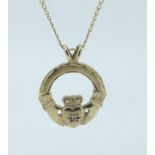 A 9 carat gold Claddagh pendant set with a small diamond on a 9 carat gold necklace, 2g