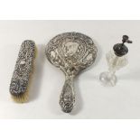 A silver brush and mirror and a cut glass and silver mounted atomiser
