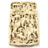 An antique Chinese Canton ivory card case with pierced and carved landscape and figurative
