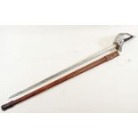 A George V officers dress sword with pierced hand guard engraved blade and leather scabbard, blade
