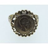 A 9 carat gold ring inset miniature Mexican coin, size N