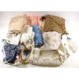 A box containing various textiles to include linen, silk, lace, a Radley scarf etc