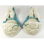 A pair of 19th century Royal Worcester wall pockets with pairs of birds on leaves, 27cm