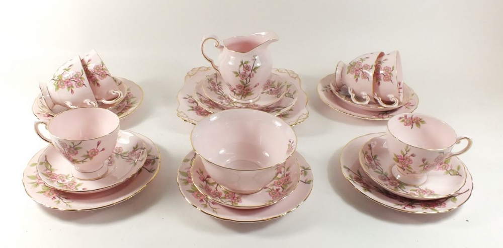 A Tuscan tea service 'Springtime' comprising: six cups and saucers, six tea plates, milk, sugar