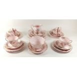 A Tuscan tea service 'Springtime' comprising: six cups and saucers, six tea plates, milk, sugar