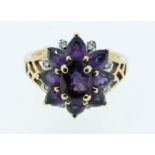 A gold amethyst and diamond flower head ring, Birmingham import marks, stamped 375 and 10k, size L-