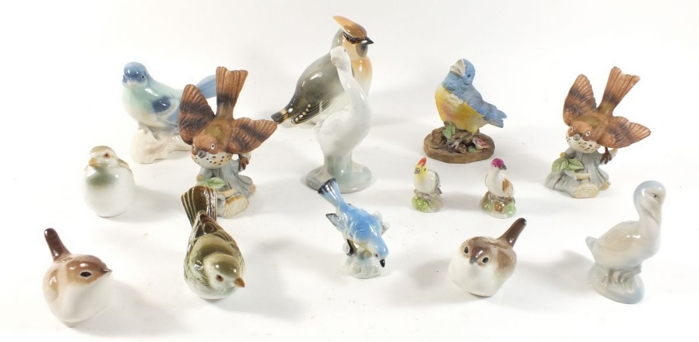 A collection of bird ornaments, including Beswick