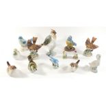 A collection of bird ornaments, including Beswick