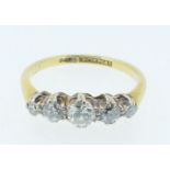 An 18 carat gold and platinum set five stone diamond ring, estimated diamond weight 0.64ct, size O-P