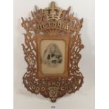 A fretwork cut mirror with Queen Victoria commemorative text, 43cm tall, 1837-1901